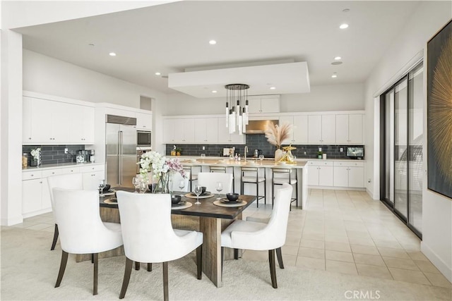 11818 N Hillsborough Ln, Porter Ranch, CA 91326 - dining room with light tile patterned floors, recessed lighting, and a chandelier