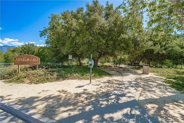 view of community featuring fence