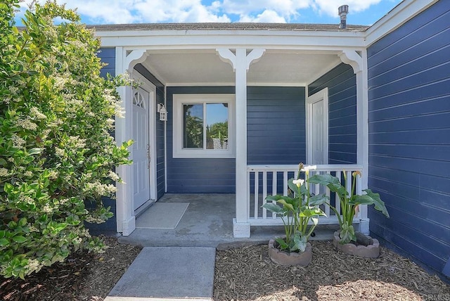 doorway to property with covered porch