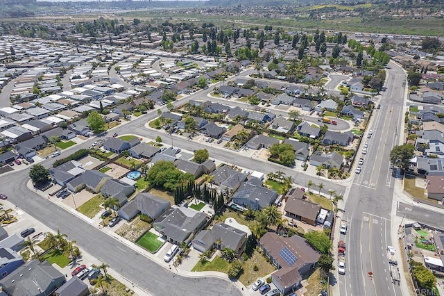 birds eye view of property with a residential view
