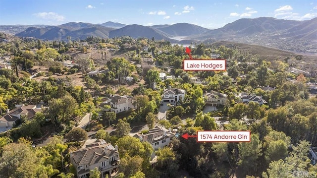 birds eye view of property with a residential view and a mountain view