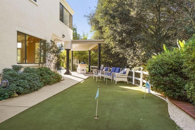 view of yard featuring a patio area and outdoor lounge area