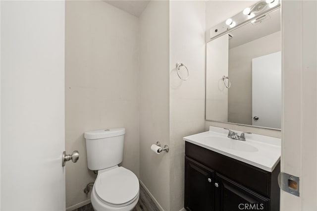 43922 Warner Trl, Palm Desert, CA 92211 - bathroom with baseboards, toilet, and vanity