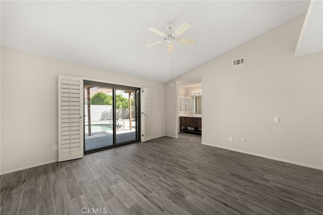 43922 Warner Trl, Palm Desert, CA 92211 - unfurnished living room featuring dark wood-style flooring, vaulted ceiling, ceiling fan, and baseboards