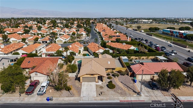 drone / aerial view featuring a residential view and a mountain view