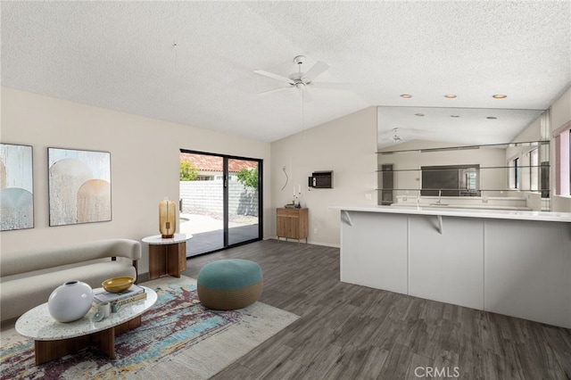 43922 Warner Trl, Palm Desert, CA 92211 - living room with wood finished floors, lofted ceiling, a textured ceiling, and ceiling fan