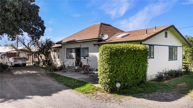 exterior space featuring a carport