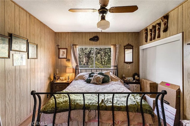 bedroom with wooden walls