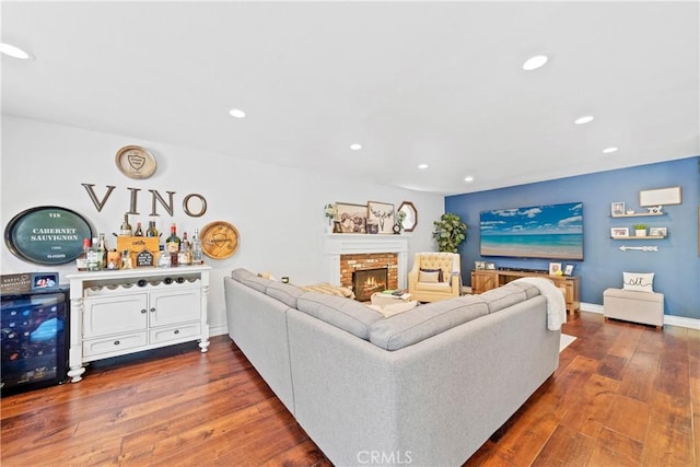 28102 Camellia Ct, Laguna Niguel, CA 92677 - living area with a brick fireplace, baseboards, a bar, recessed lighting, and dark wood-type flooring