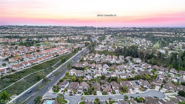 birds eye view of property with a residential view