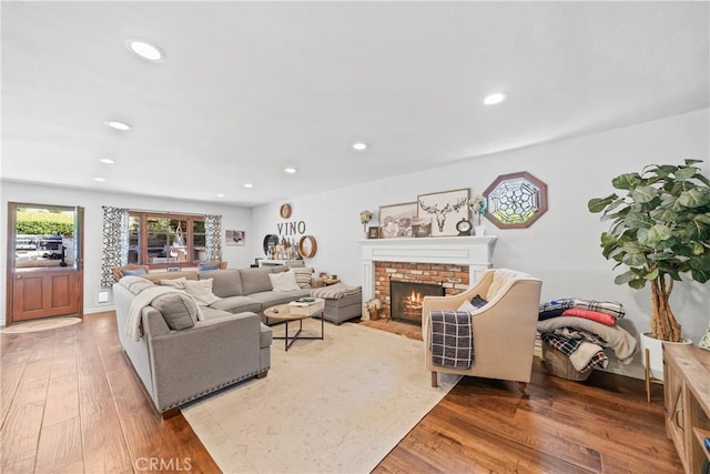 28102 Camellia Ct, Laguna Niguel, CA 92677 - living room featuring a brick fireplace, recessed lighting, and wood finished floors