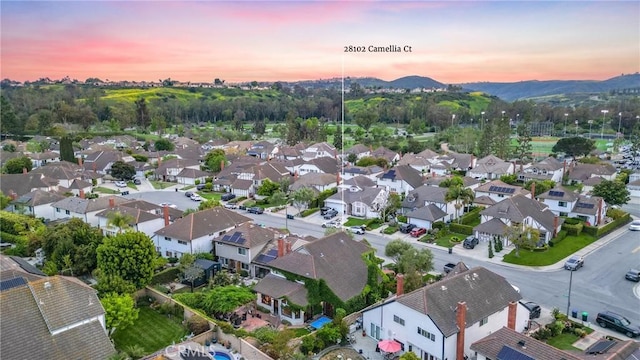 drone / aerial view with a mountain view and a residential view