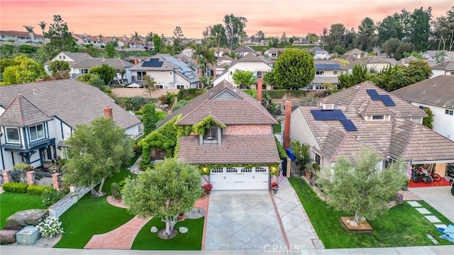 birds eye view of property with a residential view