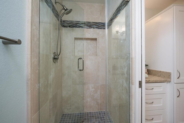 full bath with a shower stall
