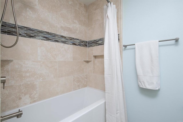 full bath featuring shower / bath combo with shower curtain