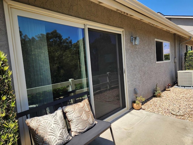 view of patio with central AC