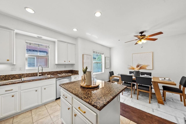 1295 Blue Jean Way Unit 2, Chula Vista, CA 91913 - kitchen with a sink, dark stone counters, dishwasher, and white cabinets