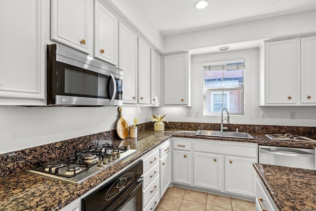 1295 Blue Jean Way Unit 2, Chula Vista, CA 91913 - kitchen featuring white cabinets, a sink, dark stone counters, stainless steel appliances, and recessed lighting
