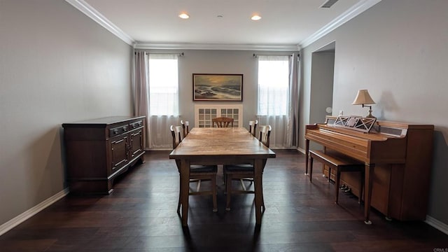 dining area with plenty of natural light, dark wood-type flooring, crown molding, recessed lighting, and baseboards