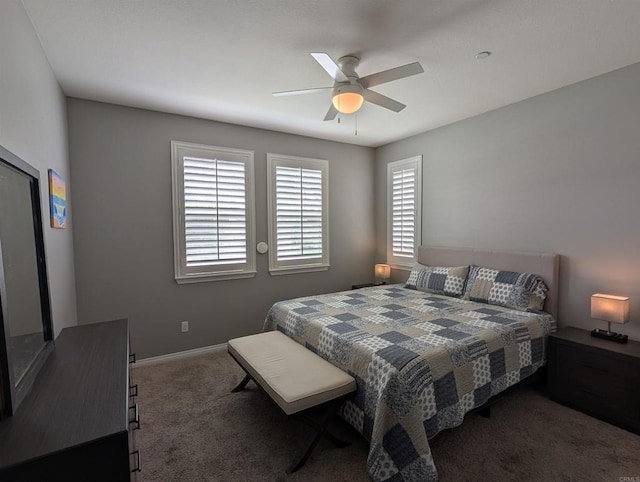 bedroom with carpet floors, ceiling fan, and baseboards