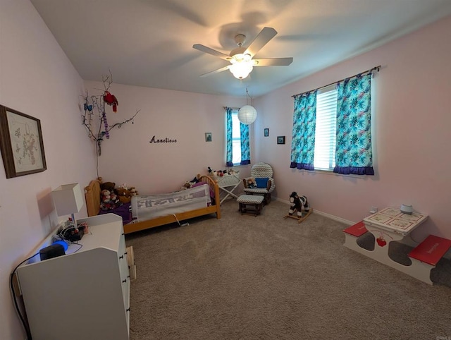 bedroom with carpet floors, a ceiling fan, and baseboards
