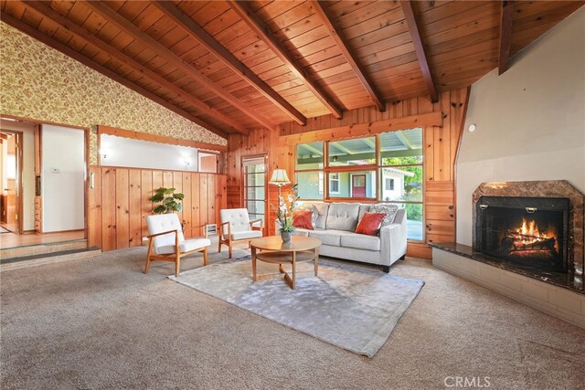 15731 Marlin Pl, Van Nuys, CA 91406 - carpeted living room featuring lofted ceiling with beams, wooden ceiling, a fireplace, and wood walls
