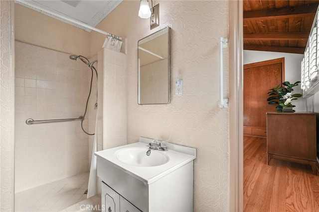 15731 Marlin Pl, Van Nuys, CA 91406 - full bathroom featuring vanity, wood finished floors, tiled shower, vaulted ceiling with beams, and wooden ceiling