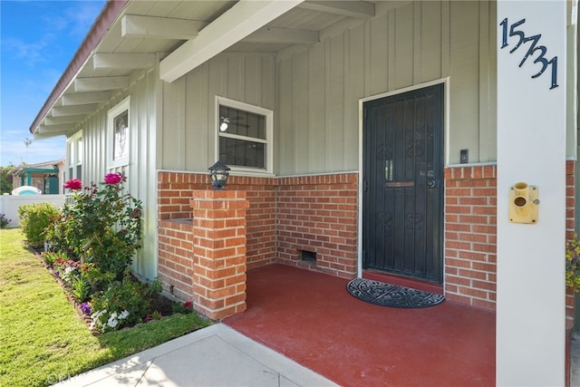 15731 Marlin Pl, Van Nuys, CA 91406 - view of exterior entry with brick siding and board and batten siding