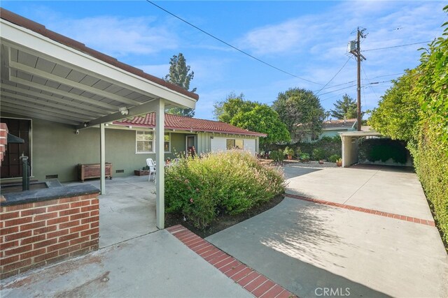 15731 Marlin Pl, Van Nuys, CA 91406 - exterior space featuring stucco siding and a patio area