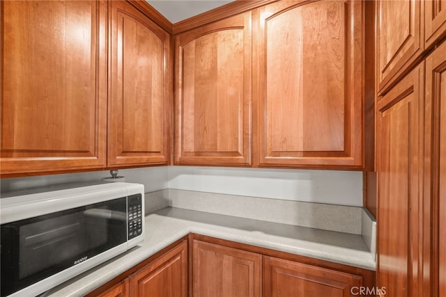 15731 Marlin Pl, Van Nuys, CA 91406 - interior space with light countertops and brown cabinets