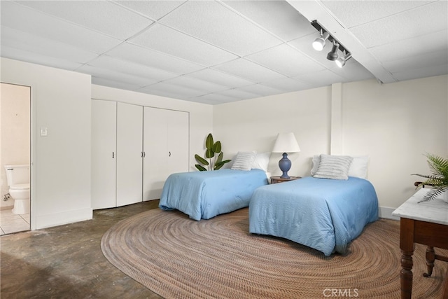 15731 Marlin Pl, Van Nuys, CA 91406 - bedroom with concrete floors, a paneled ceiling, ensuite bathroom, and a closet