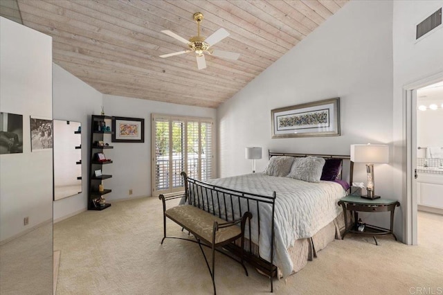 carpeted bedroom featuring visible vents, ensuite bathroom, ceiling fan, wooden ceiling, and vaulted ceiling