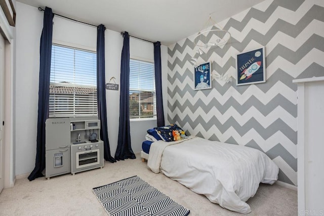 17011 Calle Trevino Unit 5, San Diego, CA 92127 - bedroom with multiple windows, carpet flooring, and an accent wall
