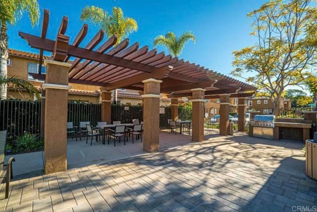 17011 Calle Trevino Unit 5, San Diego, CA 92127 - view of patio / terrace featuring an outdoor kitchen, fence, a pergola, and area for grilling