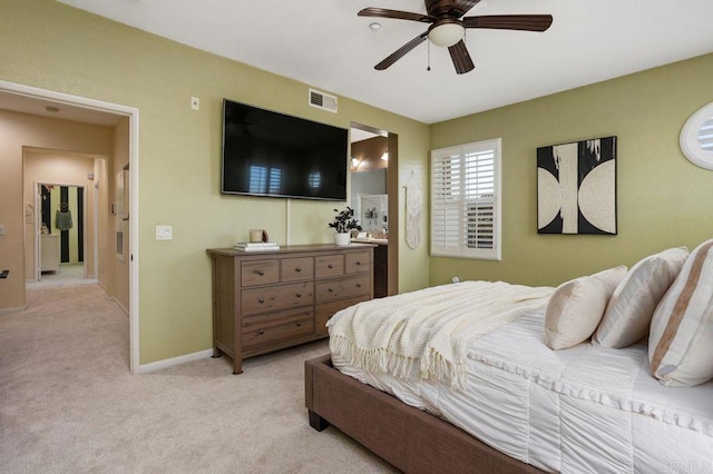 17011 Calle Trevino Unit 5, San Diego, CA 92127 - bedroom featuring baseboards, light carpet, a ceiling fan, and visible vents