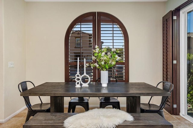 17011 Calle Trevino Unit 5, San Diego, CA 92127 - dining room with plenty of natural light and baseboards