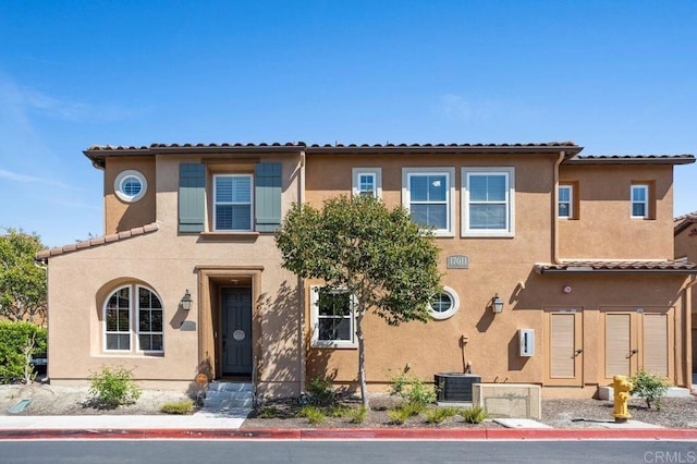 17011 Calle Trevino Unit 5, San Diego, CA 92127 - view of front of home featuring central air condition unit, a tile roof, and stucco siding