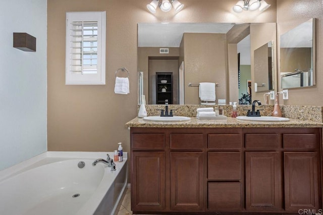 17011 Calle Trevino Unit 5, San Diego, CA 92127 - bathroom featuring a garden tub, a sink, double vanity, and visible vents