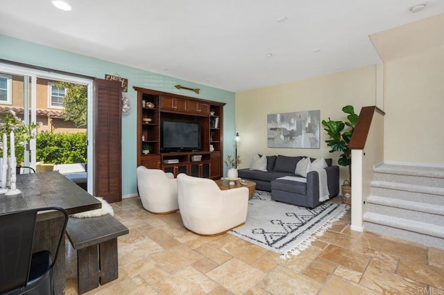 17011 Calle Trevino Unit 5, San Diego, CA 92127 - living room with recessed lighting, baseboards, stairs, and stone tile floors