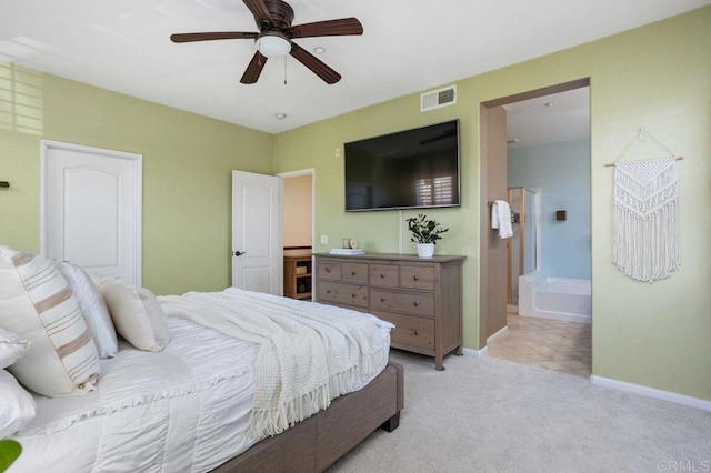 17011 Calle Trevino Unit 5, San Diego, CA 92127 - bedroom with visible vents, baseboards, ceiling fan, light colored carpet, and connected bathroom