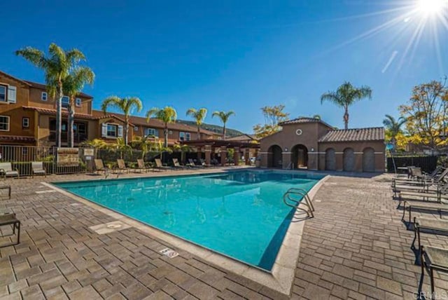 17011 Calle Trevino Unit 5, San Diego, CA 92127 - community pool with fence and a patio area