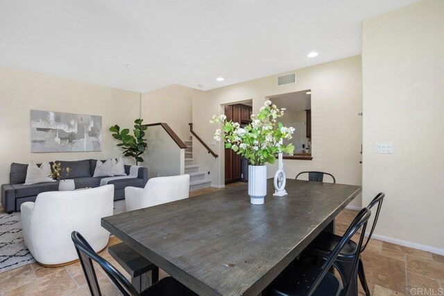 17011 Calle Trevino Unit 5, San Diego, CA 92127 - dining room featuring visible vents, stairway, baseboards, stone tile flooring, and recessed lighting