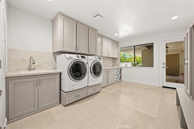 laundry area featuring visible vents, cabinet space, a sink, recessed lighting, and washer and clothes dryer