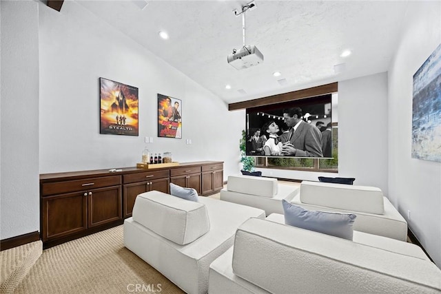 cinema with a healthy amount of sunlight, light carpet, vaulted ceiling, and recessed lighting