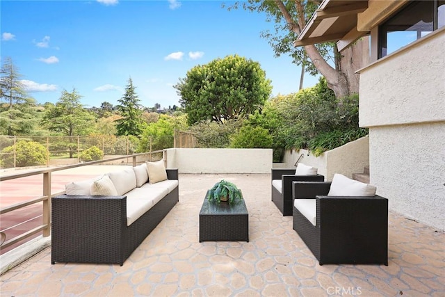 view of patio / terrace with fence and an outdoor living space
