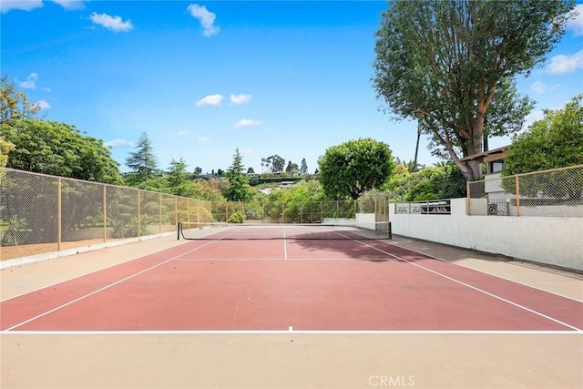 view of sport court featuring fence and community basketball court