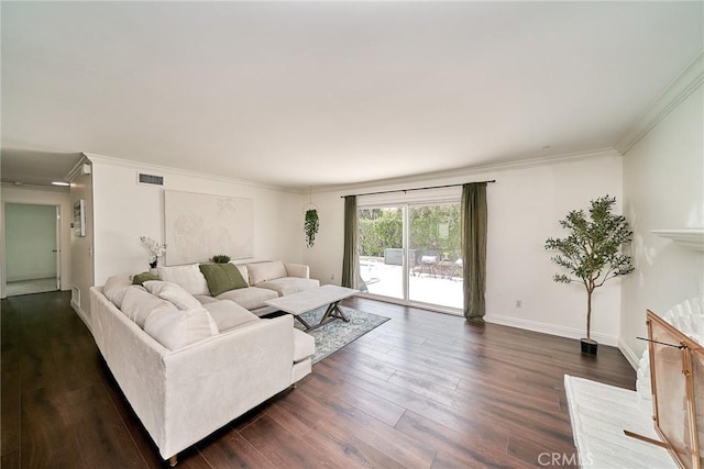 living area featuring crown molding, baseboards, visible vents, and dark wood finished floors