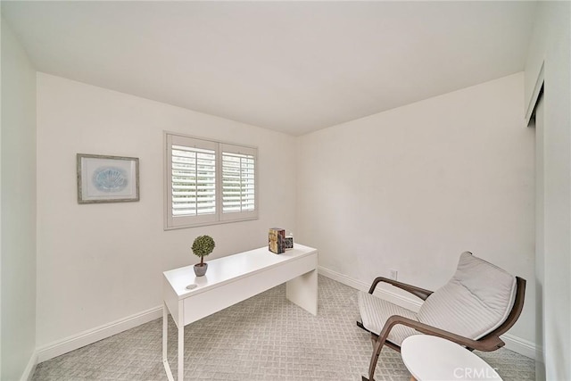 office space with baseboards