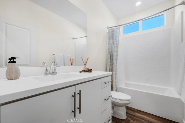 full bathroom with toilet, shower / bath combination with curtain, wood finished floors, and vanity