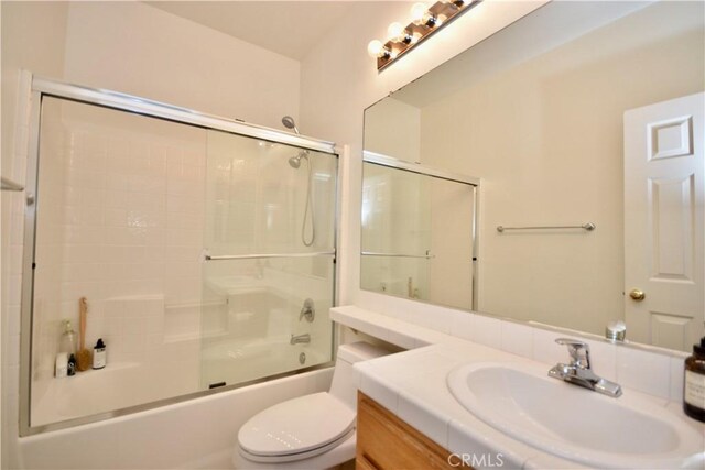 31105 Sunningdale Dr, Temecula, CA 92591 - bathroom featuring vanity, toilet, and combined bath / shower with glass door